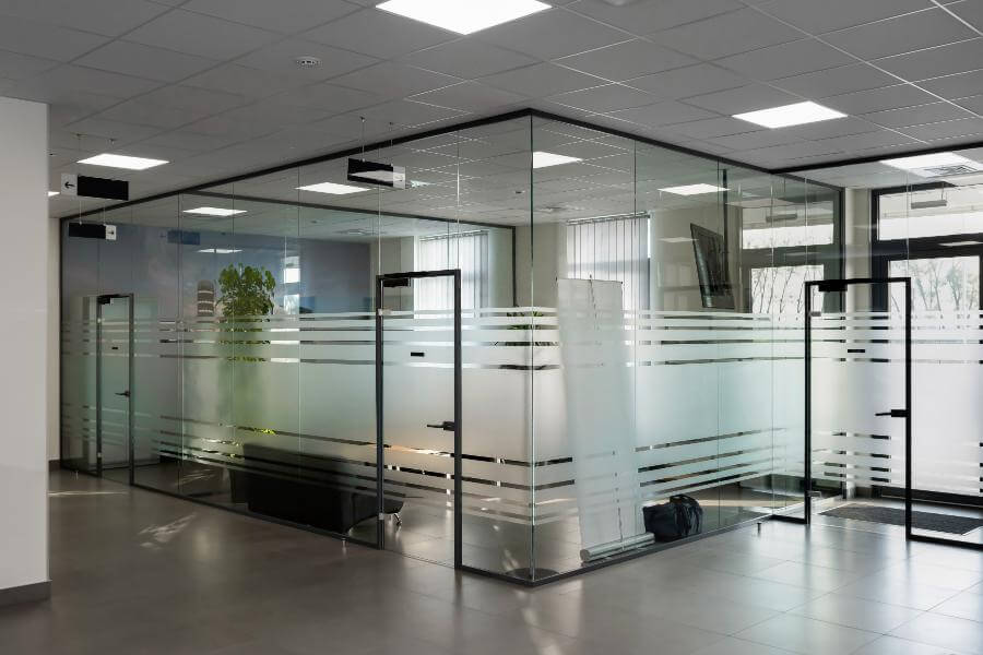 Glass partition wall with door